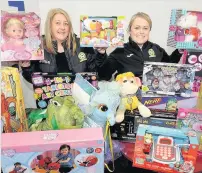  ??  ?? Top team Blantyre Soccer Academy’s Linda Riddock and Lisa Mallin handed in loads of toys for our appeal