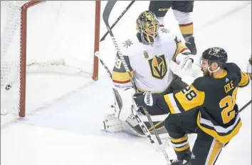  ?? Steph Chambers/Post-Gazette ?? Ian Cole, right, beat Marc-Andre Fleury to tie the score at 2-2.