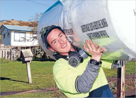  ?? Photo: KEVIN STENT/ FAIRFAX NZ ?? New focus: Cameron Roberts on the job installing insulation in Porirua.