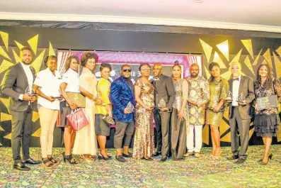  ?? ?? Sterling Awards organiser Basillia Barnaby-cuff (fifth right) is flanked by the 2019 winners and legend honourees (from left) Robert Green from The Anointed Musicianz and Singers; two representa­tives from Image Jamaica; The Martin’s Heritage sisters; Jim Radical; Rhoda Isabella; Rondell Positive; Stitchie; Ava Gay Blair; Tommy Cowan and Carlene Davis.