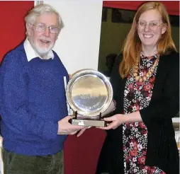  ??  ?? Colin Ferguson receives the Christine Mundy Trophy from Louise Ordish