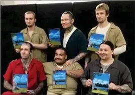  ?? PHOTO PROVIDED ?? JCAP Heartland Artists holding their work of heart. Shown in photo front row from left to right: Daniel Henderson, Jeffrey Sandoval, Brian Hubert
Back Row from left to right: Neal Hostetler, Stephan Kozikowski, Matthew Lowry
