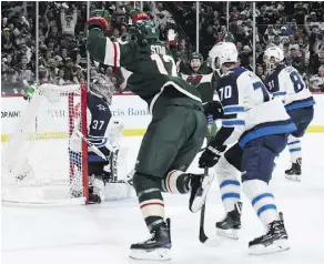  ?? HANNAH FOSLIEN/GETTY IMAGES ?? Minnesota Wild centre Eric Staal celebrates his first goal of the playoffs during the second period of Game 3 against the Winnipeg Jets in St. Paul, Minn., on Sunday.