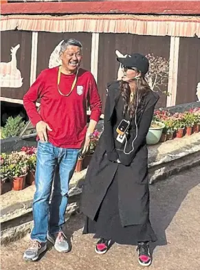  ?? ?? Left: the columnist with Zongpa, a narrator at dazhao Monastery in Lhasa, tibet, who has a good understand­ing of the tibetan way of life. her advice is to always live in the moment.