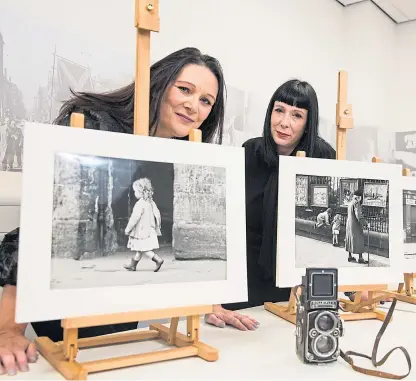  ?? Picture: Jeff Holmes/REX/Shuttersto­ck. ?? Marie-Claire and Nicola Marzaroli with some of the images.