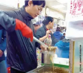  ??  ?? Dishing it out ... snake soup at Shia Wong Hip diner.