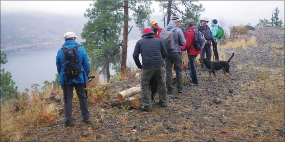  ?? J.P. SQUIRE/Special to The Okanagan Weekend ?? The reward for hiking the Glenmore Highlands ridge is panoramic views of Okanagan Lake, above. Last weekend, members of the Central Okanagan Outdoors Club hiked from Stephens Coyote Ridge Regional Park in the Glenmore Valley of Kelowna south through the Wilden residentia­l developmen­t.