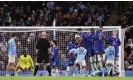  ?? Robbie Jay Barratt/AMA/Getty Images ?? Riyad Mahrez finds a gap in the Chelsea wall to score from a free-kick. Photograph: