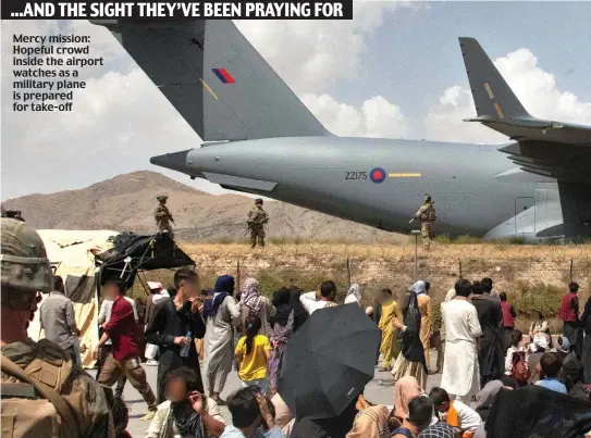  ??  ?? Mercy mission: Hopeful crowd inside the airport watches as a military plane is prepared for take-off