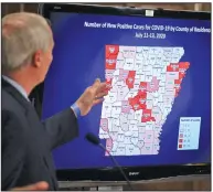  ?? (Arkansas Democrat-Gazette/Staton Breidentha­l) ?? Gov. Asa Hutchinson goes over the latest data Monday during his coronaviru­s briefing at the state Capitol in Little Rock.