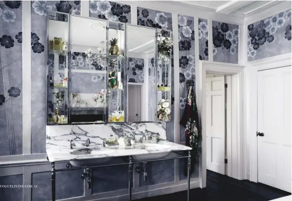  ??  ?? this page: de Gournay hand-painted Anemones in Light wallpaper in Dusk on custom Xuan ricepaper; enquiries to Milgate. opposite page: Moss in the bathroom of her north London home, which served as the design template of the wallpaper range.