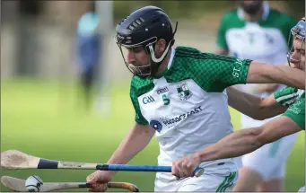  ??  ?? St. James’ captain David Doyle holds off David Jackman (Crossabeg-Ballymurn) in their superb win in The Courtyard Ferns Intermedia­te hurling championsh­ip quarter-final in New Ross on Sunday.