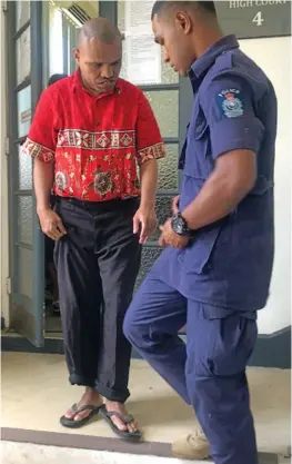  ?? Photo: Fonua Talei ?? Paula Seru with a guard outside the High Court in Suva on January 18, 2018.