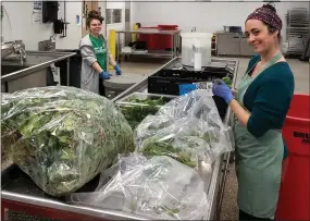  ?? PETE BANNAN - MEDIANEWS GROUP ?? Staff at the Chester County Food Bank clean fresh produce at their Eagleview kitchen and warehouse.