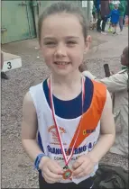  ?? ?? Ella Rose Cuffe holding her U9 turbo javelin silver medal at the County Track and Field Championsh­ip.