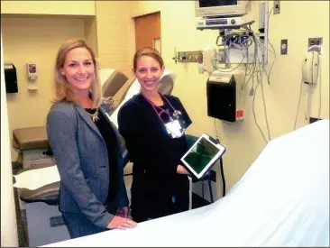  ??  ?? Cornerston­e CEO Jessica Long (left) and Juli Ray, PAC, in patient room with patient experience tablet. (Messenger photo/Mike O’Neal)