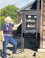  ??  ?? Community spirit Pictured with The Guiding Light box on Emma Street is volunteer Gill Oakes