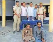  ?? HT PHOTO ?? The two men arrested on charges of smuggling cows at Kaman police station in Bharatpur.