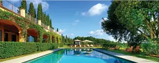  ??  ?? Dive in: The inviting swimming pool at Castello del Nero in Tuscany