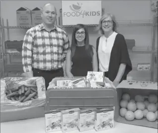  ?? CATHIE COWARD, THE HAMILTON SPECTATOR ?? Jeremiah Pike, left, of 100 Men Who Give a Damn, Alex Zaccheo of Food 4 Kids, and Megan Hoernke of 100 Women Who Care have already teamed up in a charity sponsorshi­p to help feed hungry children in Hamilton.