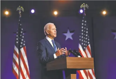  ?? Angela Weiss / AFP / Getty Images ?? “It’s time to come together as a nation,” Democratic presidenti­al nominee Joe Biden told a crowd in Delaware.