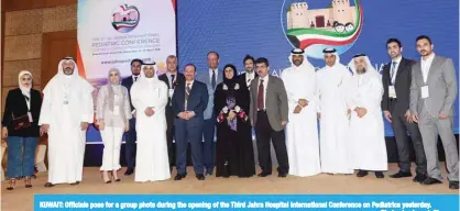  ?? —Photos by Joseph Shagra ?? KUWAIT: Officials pose for a group photo during the opening of the Third Jahra Hospital Internatio­nal Conference on Pediatrics yesterday.