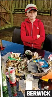  ?? ?? Above: Joe Dudgeon, nine, with the rubbish he collected Left: Jupiter Community Free School pupils take a brief rest