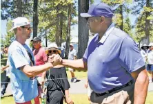  ?? Jeff Bayer / American Century Championsh­ip ?? Charles Barkley greets a spectator during the second round of the American Century Championsh­ip in Stateline, Nev.