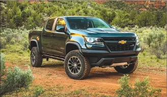  ??  ?? This undated photo provided by General Motors shows the 2018 Chevrolet Colorado ZR2 pickup truck. The ZR2 is a highly specialize­d off-road pickup truck with a raised ride height, off-road tires, modified bumpers and fenders, and underbody skid plates.