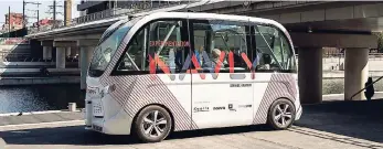  ??  ?? In this September 9, 2016 file photo, the driverless electric free shuttle Navly drives through a district of Lyon, central France, as part of an experiment. Two electric-power EZ10 minibuses, which can carry up to six seated passengers, were put into...