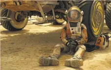  ?? 20th Century Fox ?? A weary astronaut ponders his odds for survival alone on Mars in Ridley Scott’s “The Martian.”