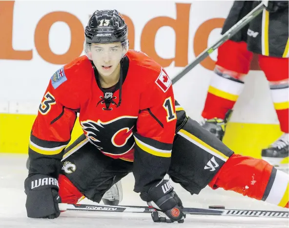  ?? — MIKE DREW/FILES ?? Once Johnny Gaudreau finds his groove, the Calgary Flames look like a team bound for the playoffs. For now, though, it’s been a struggle on defence for the pint-sized playmaker and fellow franchise cornerston­e Sean Monahan, who are a combined minus-27.