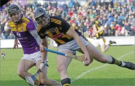  ??  ?? Joe O’Connor staying close to Walter Walsh in Chadwicks Wexford Park on Sunday. The St. Martin’s clubman and his team-mates will begin the defence of their Pettitt’s Senior hurling championsh­ip title against Rathnure in early April.