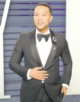  ?? AP ?? This February 24 file photo shows John Legend at the Vanity Fair Oscar Party in Beverly Hills, California. People magazine has named Legend as the ‘Sexiest Man Alive’ in their special November double issue.