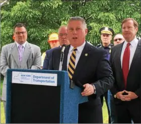  ??  ?? Former Cohoes mayor and current Assemblyma­n John McDonald III, D-Cohoes, speaks about the importance of redesignin­g Route 787 for the citizens of Cohoes during a press conference near Bridge Avenue.