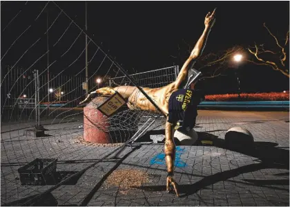  ??  ?? Protest...Malmo supporters have made their feelings known by vandalisin­g a statue of their former player outside the Eleda Stadion