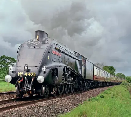  ?? DAVID KIPPAX/SNGLT ?? Running in temporary wartime black livery, No. 4498 returned to the main line following overhaul on May 21 with a Sir Nigel Gresley Locomotive Trust members special. It headed from Crewe to Carlisle and back via Carnforth.