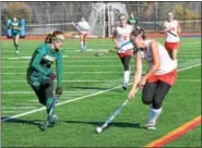  ?? THOMAS NASH - DIGITAL FIRST MEDIA ?? Owen J. Roberts’ Maddi Koury (20) carries it upfield while Emmaus defender Alison Johnston gives chase during Saturday’s game.