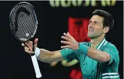  ??  ?? War of words: Djokovic enjoys yesterday’s win