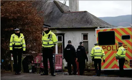  ??  ?? Police search the house where Margaret Fleming lived in Inverkip