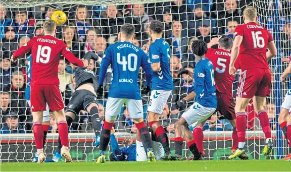  ?? Picture: SNS Group. ?? Scott McKenna fires Aberdeen into the lead as Rangers lose their league leaders status after only three days.