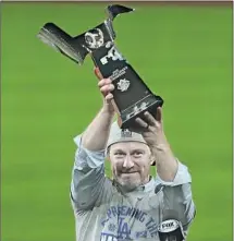 ?? Robert Gauthier Los Angeles Times ?? DODGERS EXECUTIVE Andrew Friedman, hoisting the NL title trophy, previously steered the Rays into contender status.