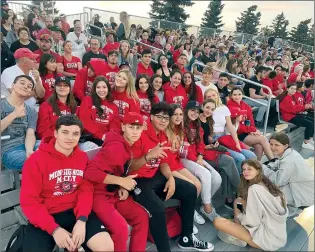  ?? SUBMITTED PHOTO ?? Internatio­nal students showing off their red Monsignor McCoy High School sweatshirt­s at a Colts football game.