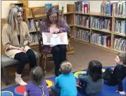  ?? Photo submitted ?? Pictured are Ashley Parik (left) and Executive Director of the Kane Area Community Center, Michelle Palmer (right). Both are reading to the 3-year-old students from the Kane Community Preschool class at the Friends' Memorial Public Library on Wednesday.