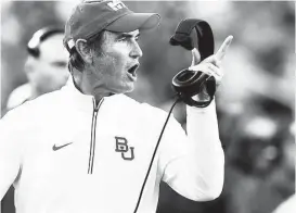  ?? LM Otero / Associated Press ?? The sexual assault scandal also cost coach Art Briles his job. Briles, who left Baylor with a 65-37 overall record, later ripped the school, accusing it of wrongful terminatio­n.