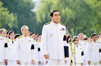  ??  ?? BANGKOK: Thai Prime Minister Prayuth Chan-O-Cha presides over a mass pledge of allegiance to the late Thai King Bhumibol Adulyadej during a ceremony at the Government House in Bangkok.—AFP