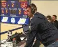  ?? MARK PODOLSKI — THE NEWS-HERALD ?? John Carroll starting quarterbac­k Anthony Moeglin calls the men’s basketball team’s game Feb. 3 at JCU’s Tony DeCarlo Varsity Center.