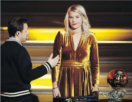  ?? — THE ASSOCIATED PRESS ?? French DJ and musician Martin Solveig, left, asked Norwegian soccer star Ada Hegerberg if she twerks after she won the inaugural Ballon d’Or soccer award Monday.