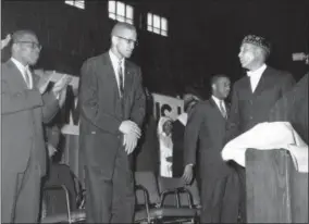  ?? PAUL CANNON — THE ASSOCIATED PRESS FILE ?? In this file photo, Elijah Muhammad, founder and head of the Nation of Islam, right, introduces Malcolm X in Chicago. A Smithsonia­n Channel series, “The Lost Tapes: Malcolm X,” examining the life of civil right leader Malcolm X, follows the advocate’s...