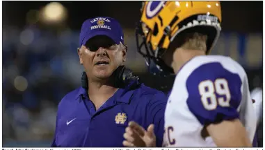  ?? (Arkansas Democrat-Gazette/Justin Cunningham) ?? Coach John Fogleman (left) won his 100th career game at Little Rock Catholic on Friday. Before coaching the Rockets, Fogleman led the Malvern Leopards to a 43-29 record with five playoff appearance­s in six seasons.